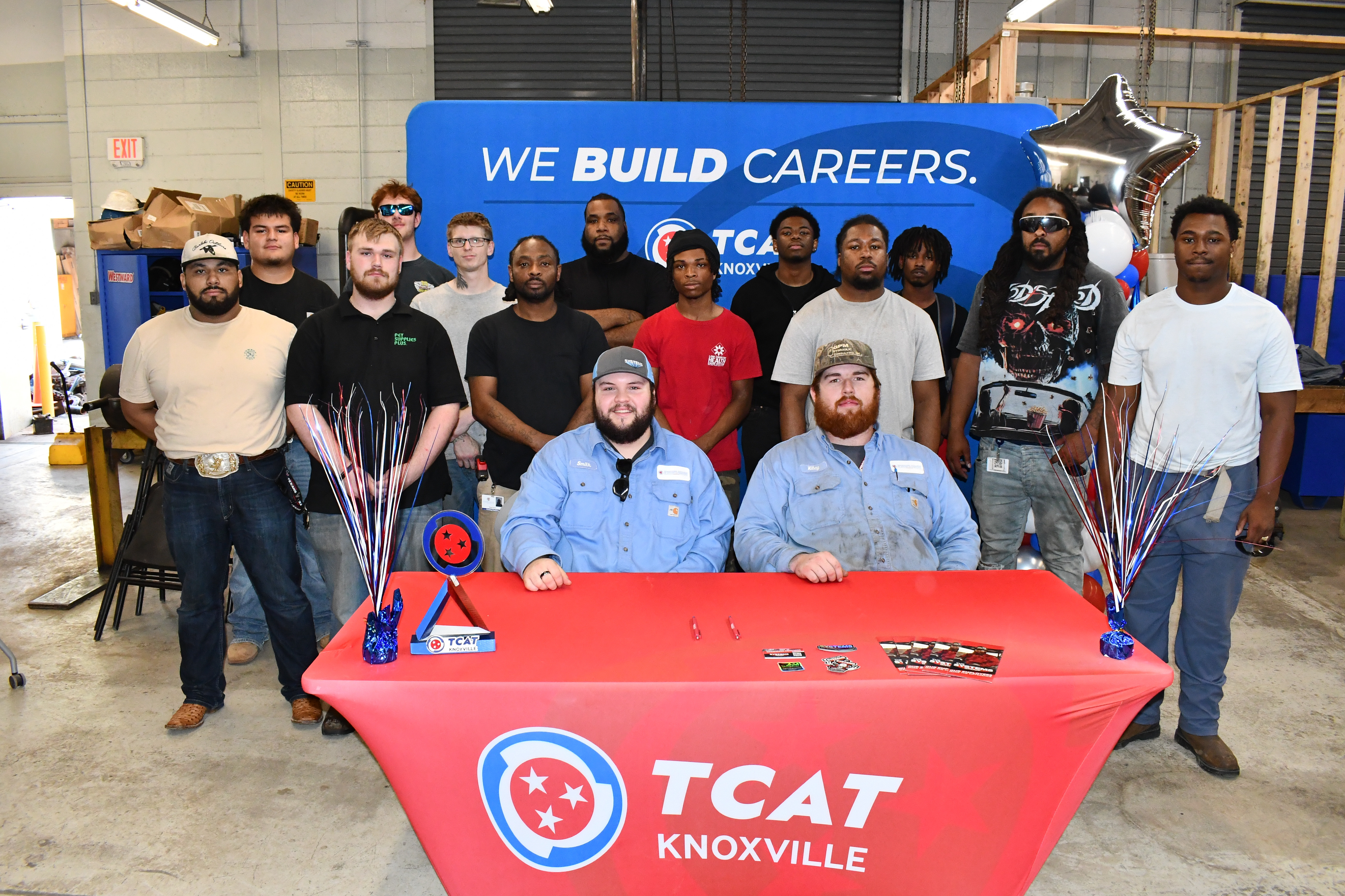 As part of the partnership, 12 current TCAT Knoxville students will travel to Alabama to work on an active project with The Systems Group.