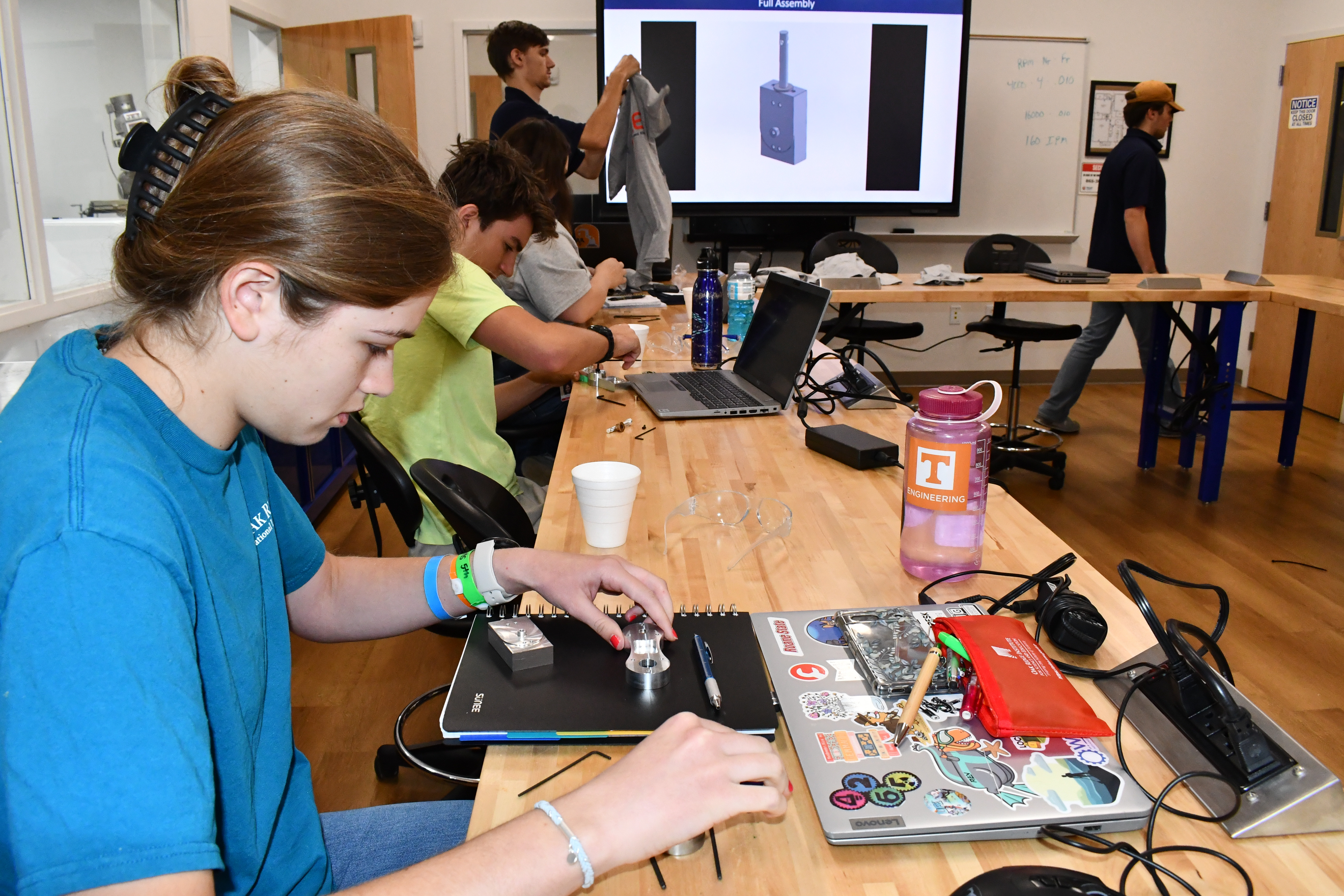 High school senior Leah Thelen builds an air motor during the ACE Bootcamp.